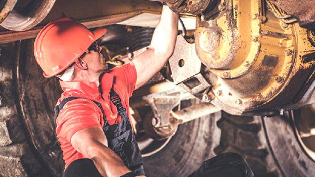 Female working on heavy plant machinery.