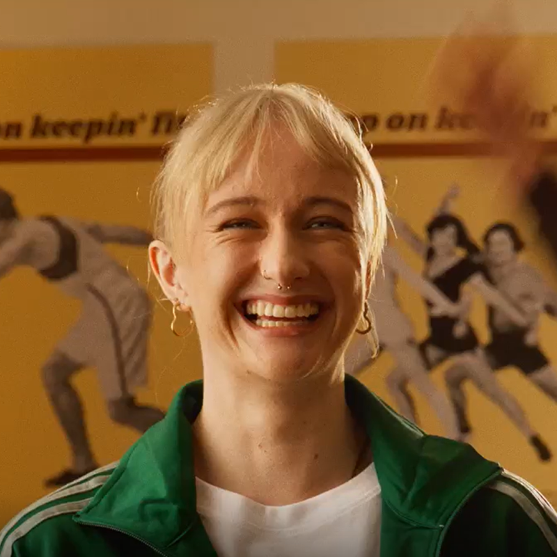 female facing the camera smiling