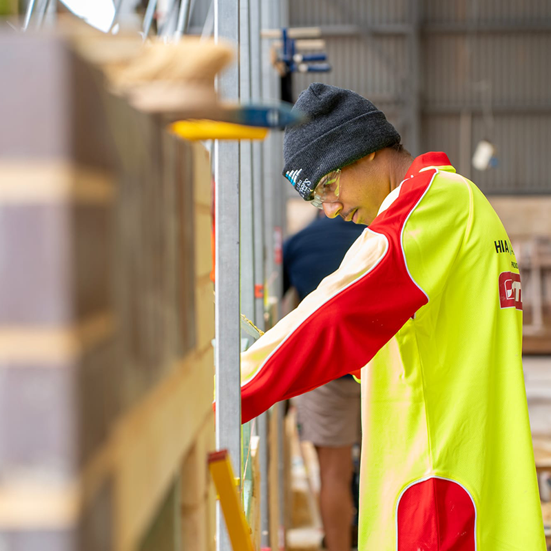 male apprentice working at a workshop setting