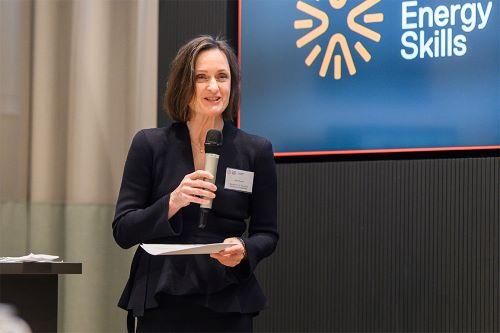 Jodie Wallace speaking into a microphone at n event.