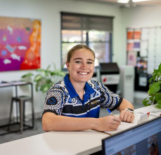 JCS staff member smiling at camera.