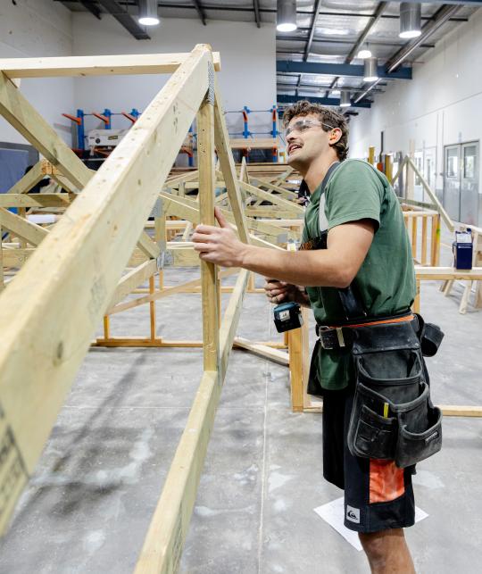 Carpenter building roof.